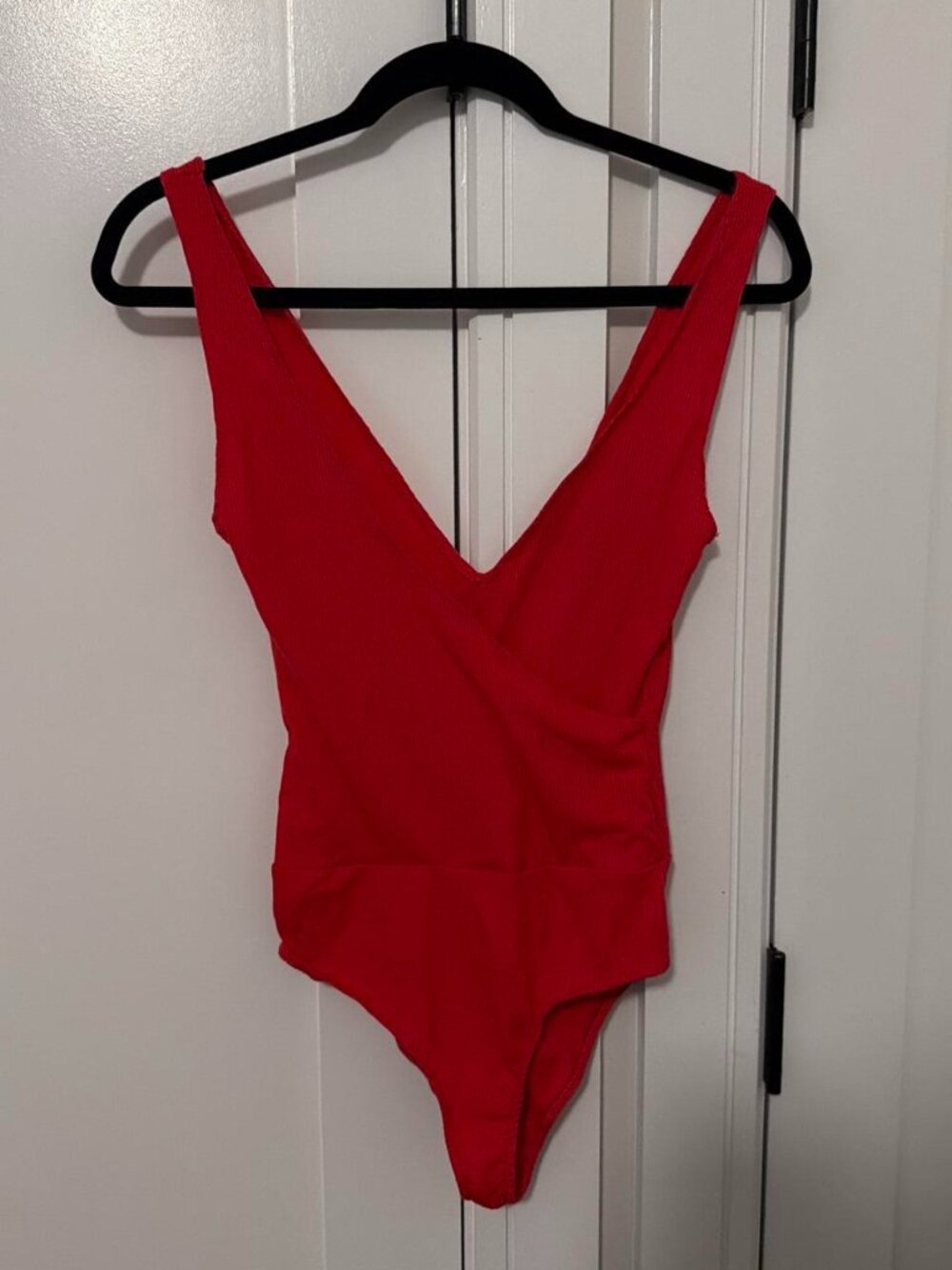 Zara red bodysuit with v-neckline and cross front detail